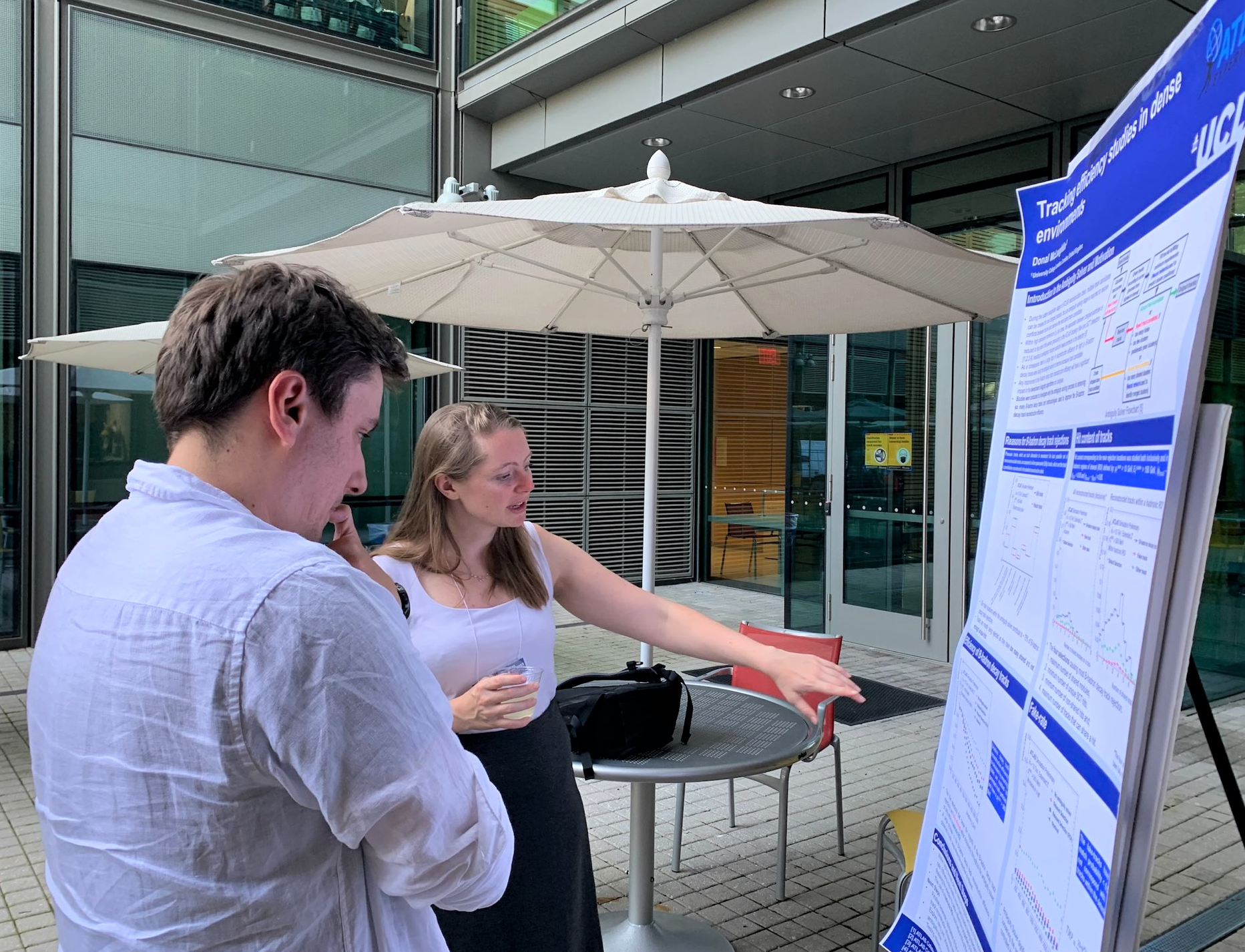 Liv Vage of Imperial College and Donal Joseph Mclaughlin from University College London during the poster session at the CTD 2022 workshop.